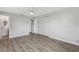 Bedroom featuring a ceiling fan, wood-look floors, and large closet at 525 Legume Dr, Port Orange, FL 32127