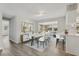 Open concept dining area with stylish table set and bar seating by an adjacent kitchen at 525 Legume Dr, Port Orange, FL 32127