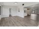 Open-concept floor plan with wood-look floors and bright, light gray paint at 525 Legume Dr, Port Orange, FL 32127