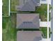Aerial shot of roof and yard with a view from above at 543 Pine Tree Bridge Trl, St Cloud, FL 34772