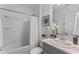 Well-lit bathroom with shower and vanity at 543 Pine Tree Bridge Trl, St Cloud, FL 34772