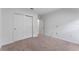 Bedroom showing bi-fold door closet and neutral carpeting at 543 Pine Tree Bridge Trl, St Cloud, FL 34772