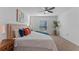 Inviting bedroom with a large window, ceiling fan, and cozy decor at 543 Pine Tree Bridge Trl, St Cloud, FL 34772