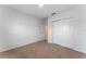 Bedroom showcasing closet space and neutral carpeting at 543 Pine Tree Bridge Trl, St Cloud, FL 34772