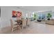 Bright dining room with a view into a living room with comfortable seating at 543 Pine Tree Bridge Trl, St Cloud, FL 34772