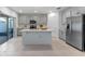 Spacious kitchen features gray cabinets, an island, and stainless steel refrigerator at 543 Pine Tree Bridge Trl, St Cloud, FL 34772