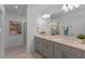 Modern main bathroom with double sinks, quartz countertops, stylish fixtures, and a separate shower at 543 Pine Tree Bridge Trl, St Cloud, FL 34772