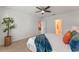 Neutral main bedroom featuring a ceiling fan, a window, and carpeted floors at 543 Pine Tree Bridge Trl, St Cloud, FL 34772