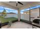 Covered patio with screened enclosure, offering great views of fenced backyard at 543 Pine Tree Bridge Trl, St Cloud, FL 34772