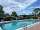 Inviting community pool area with ample seating, perfect for relaxing and enjoying the sunshine at 601 Casa Park Court B Ct, Winter Springs, FL 32708