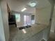 Modern kitchen featuring granite countertops, stainless steel appliances, and ample cabinet space at 601 Casa Park Court B Ct, Winter Springs, FL 32708