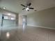 Living room featuring tiled floors and a ceiling fan at 601 Casa Park Court B Ct, Winter Springs, FL 32708