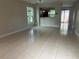 Open living room featuring neutral walls, tile flooring, and abundant natural light, perfect for entertaining at 601 Casa Park Court B Ct, Winter Springs, FL 32708