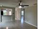 Bright and spacious living room with tile flooring and ample natural light, ready for personal touches at 601 Casa Park Court B Ct, Winter Springs, FL 32708