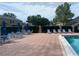 Inviting community pool area with ample seating, perfect for relaxing and enjoying the sunshine at 601 Casa Park Court B Ct, Winter Springs, FL 32708