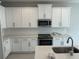 Updated kitchen with stainless steel appliances, white subway tile backsplash, and granite countertops at 620 Pothos St, Apopka, FL 32703