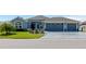 Charming single story home with a three car garage, inviting front yard and meticulous landscaping at 6328 Merhottein Loop, The Villages, FL 32163
