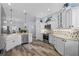Kitchen boasts stainless appliances, updated backsplash, breakfast bar, and view into living and dining area at 6328 Merhottein Loop, The Villages, FL 32163
