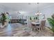 Open concept living room and dining area with stylish furniture and ample natural light at 6328 Merhottein Loop, The Villages, FL 32163
