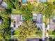 Aerial view of the home showcasing the pool, mature trees, and well-maintained landscaping at 687 Saranac Dr, Winter Springs, FL 32708