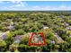 Aerial view showcases the property and surrounding greenery, location marked with indicator at 687 Saranac Dr, Winter Springs, FL 32708