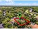Aerial view of the neighborhood surrounded by trees, showing the location of the house at 687 Saranac Dr, Winter Springs, FL 32708
