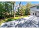Backyard deck featuring a large deck, lush landscaping and a tranquil outdoor seating area at 687 Saranac Dr, Winter Springs, FL 32708