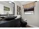 Chic bathroom features a sleek, modern sink and stylish vanity with natural light coming from the window at 687 Saranac Dr, Winter Springs, FL 32708