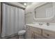 Bright bathroom featuring a vanity with decorative mirror, and a shower with curtain at 687 Saranac Dr, Winter Springs, FL 32708