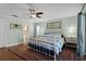 Comfortable bedroom with decorative rug, ceiling fan, and adjacent bathroom at 687 Saranac Dr, Winter Springs, FL 32708