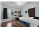 Inviting bedroom with hardwood floors, a comfortable bed, and a bright window for natural light at 687 Saranac Dr, Winter Springs, FL 32708