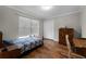 Cozy bedroom with hardwood floors and lots of natural light; a relaxing retreat at 687 Saranac Dr, Winter Springs, FL 32708