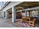Relaxing outdoor living space with a dining area and comfortable seating, ideal for entertaining guests at 687 Saranac Dr, Winter Springs, FL 32708
