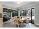 Dining area with outdoor access to a pool and covered patio, perfect for entertaining at 687 Saranac Dr, Winter Springs, FL 32708