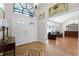 Grand entryway featuring tile and wood flooring that leads into a sitting room at 687 Saranac Dr, Winter Springs, FL 32708