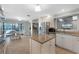 Island kitchen with stainless steel appliances, eat-in area, and access to the outdoor patio at 687 Saranac Dr, Winter Springs, FL 32708