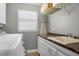 Well-lit laundry room with counter space and modern appliances for easy laundry days at 687 Saranac Dr, Winter Springs, FL 32708