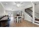 Spacious living room features tiled flooring, staircase, ceiling fans, and recessed lighting at 687 Saranac Dr, Winter Springs, FL 32708