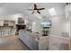 Comfortable living room with a brick fireplace and a ceiling fan for comfortable living at 687 Saranac Dr, Winter Springs, FL 32708