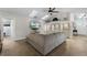 Comfortable living room with vaulted ceiling, skylights, built-in shelving, and media center at 687 Saranac Dr, Winter Springs, FL 32708