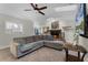 Open living room features fireplace and view of kitchen over the large comfortable couch at 687 Saranac Dr, Winter Springs, FL 32708