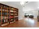 Cozy living area featuring built-in bookshelves and wood floors at 687 Saranac Dr, Winter Springs, FL 32708