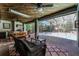 Enclosed patio with an outdoor kitchen featuring a built-in grill, perfect for al fresco dining at 687 Saranac Dr, Winter Springs, FL 32708