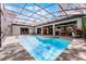 Stunning screened-in pool area surrounded by a spacious patio, perfect for enjoying sunny days and relaxation at 687 Saranac Dr, Winter Springs, FL 32708