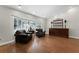 A sitting room featuring wood flooring, shuttered windows and decorative furniture at 687 Saranac Dr, Winter Springs, FL 32708