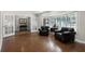 Sitting room featuring wood flooring, shuttered windows and french doors at 687 Saranac Dr, Winter Springs, FL 32708