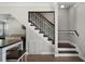 Beautiful staircase with dark wood and iron banister detailing, and access to the living area at 687 Saranac Dr, Winter Springs, FL 32708