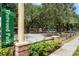 A view of Trotwood Park with parking, landscaping, picnic tables and shade at 687 Saranac Dr, Winter Springs, FL 32708