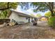 Spacious backyard featuring a pool with a screened enclosure and room for outdoor activities at 745 Oak Ln, Orange City, FL 32763