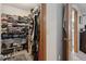 Walk-in closet offers ample shelving, storage for clothes and shoes, and hardwood door trim at 745 Oak Ln, Orange City, FL 32763